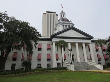The current State Capitol Building, 22 floors tall, with the prior Capitol Building, now State of Florida museum in the foreground.